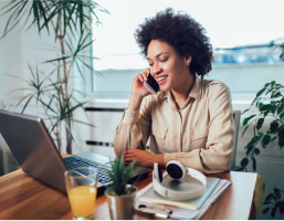 Entrepreneur sitting at desk in home office working online